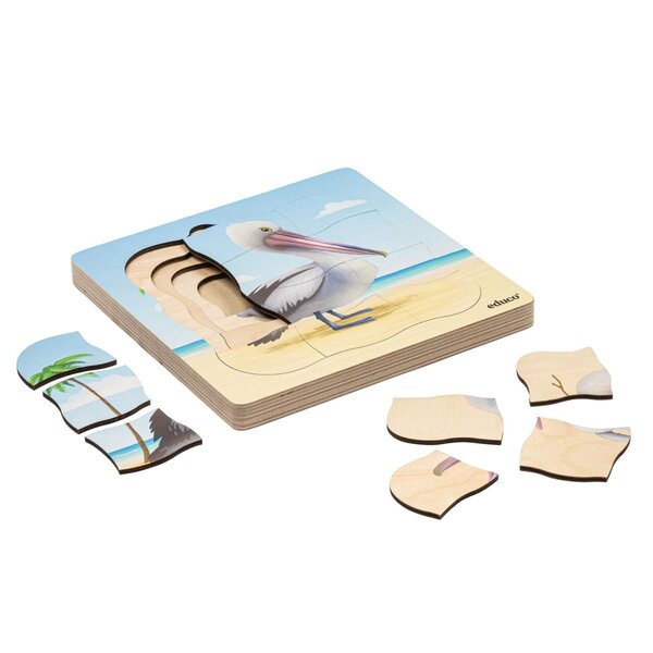 Sur la plage - le pélican pousse  31 pièces de puzzle