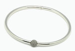 Bracelet rigide avec coeur ressort