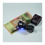 Loupe de bijoutier avec lampe UV  grossissement 10x.