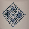 Tasse en céramique blanche motif carreaux